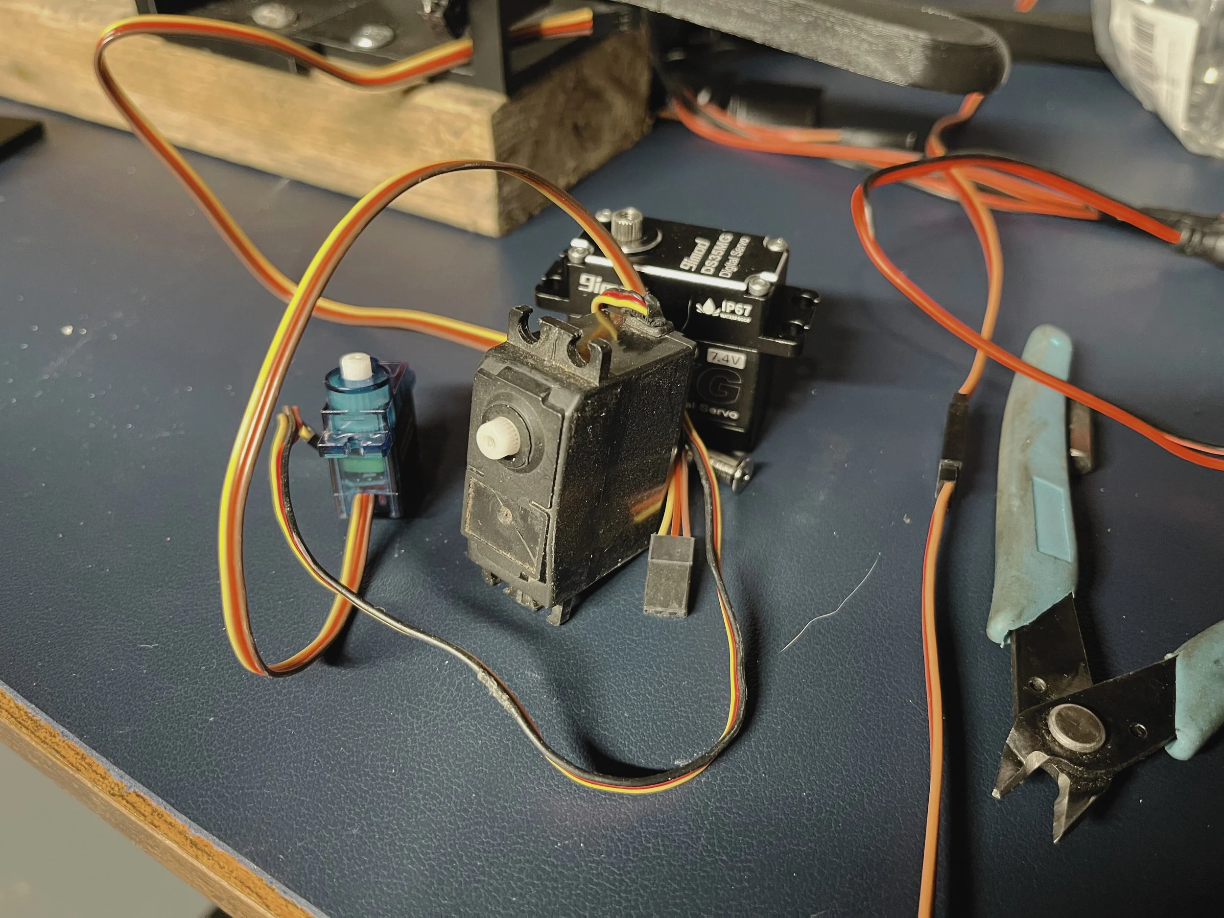 Comparison of actuator options tested for the OpenPedal project, including micro servos, heavy-duty servos, stepper motors, and linear actuators. Micro servos were selected as the optimal solution.